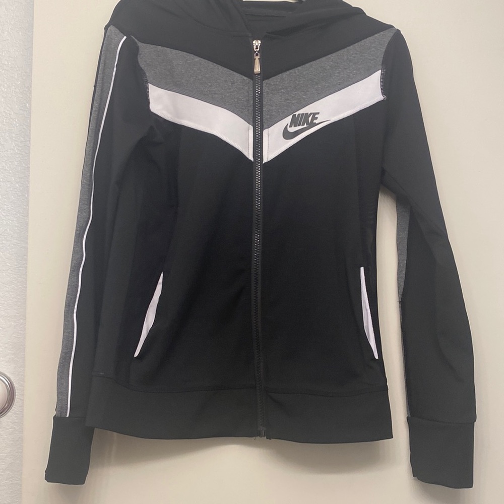 Preowned Nike hooded active wear jacket comes from a smoke free home